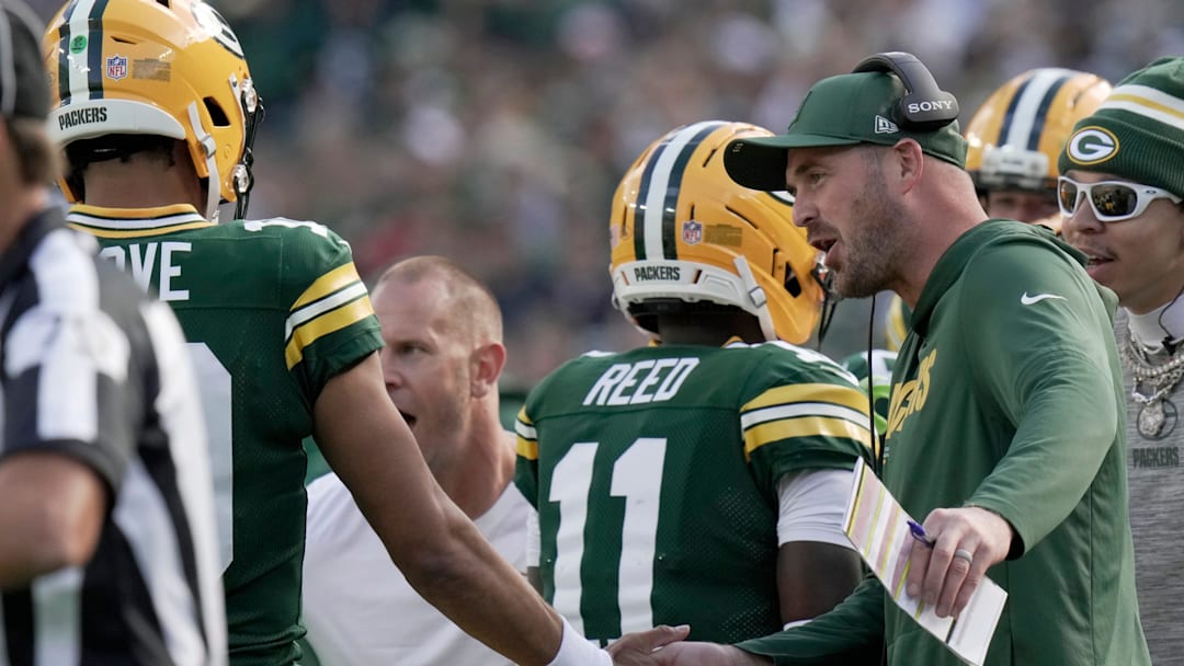 Green Bay Packers quarterback coach Sean Mannion is shown congratulating quarterback Jordan Love (10) during the second quarter of their game Sunday, September 7, 2025 at Lambeau Field in Green Bay, Wisconsin. The Green Bay Packers beat the Detroit Lions 27-13.