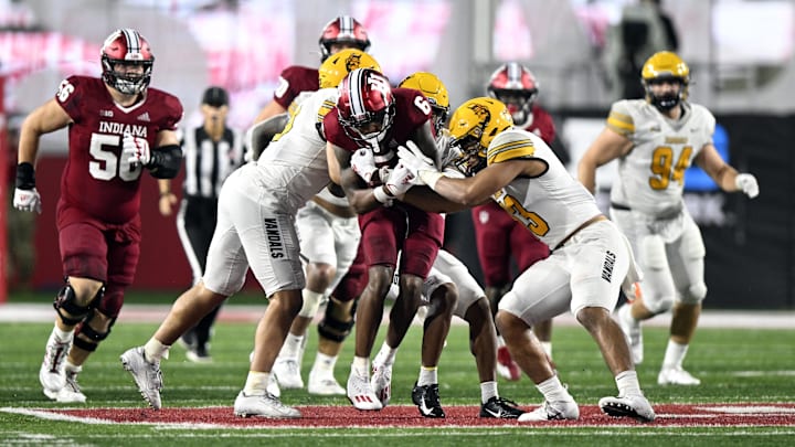 Indiana Hoosiers wide receiver Cam Camper (6) is tackled by multiple Idaho Vandals players during the second half at Memorial Stadium. The Hoosiers won 35-22 in one of its games against a FCS opponent.