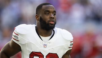 Dec 15, 2024; Glendale, Arizona, USA; Arizona Cardinals running back Trey Benson (33) against the New England Patriots at State Farm Stadium. Mandatory Credit: Mark J. Rebilas-Imagn Images