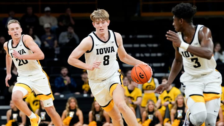 Iowa Hawkeyes forward Cooper Koch (8) dribbles down court against Rider Tuesday, Nov. 19, 2024 at Carver-Hawkeye Arena in Iowa City, Iowa.