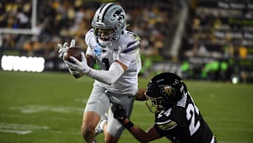 Oct 12, 2024; Boulder, Colorado, USA; Kansas State Wildcats wide receiver Jayce Brown (1) scores as he is defended by Colorado Buffaloes cornerback Preston Hodge (24) during the second half at Folsom Field. Mandatory Credit: Christopher Hanewinckel-Imagn Images
