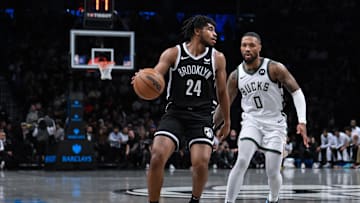 Nov 6, 2023; Brooklyn, New York, USA; Brooklyn Nets guard Cam Thomas (24) looks for an opening against Milwaukee Bucks guard Damian Lillard (0) during the first quarter at Barclays Center. Mandatory Credit: John Jones-Imagn Images