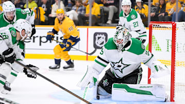 Oct 10, 2024; Nashville, Tennessee, USA; Dallas Stars goaltender Jake Oettinger (29) blocks the shot of Nashville Predators left wing Filip Forsberg (9) during the first period at Bridgestone Arena. Mandatory Credit: Steve Roberts-Imagn Images
