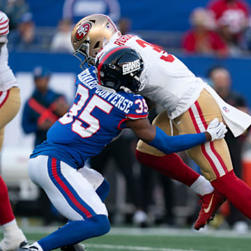 San Francisco 49ers running back Brian Robinson Jr. (3) runs with the ball before being tackled by New York Giants cornerback Jarrick Bernard-Converse (35) during a week 9 game between New York Giants and San Francisco 49ers at MetLife Stadium on Sunday, Nov. 2, 2025.