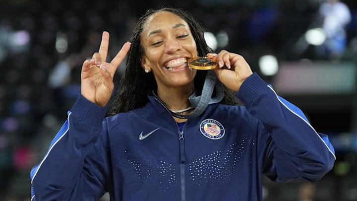 Aug 11, 2024; Paris, France; United States forward A'Ja Wilson (9) celebrates with the gold medal after defeating France in the women's gold medal game during the Paris 2024 Olympic Summer Games at Accor Arena. Mandatory Credit: Kyle Terada-Imagn Images