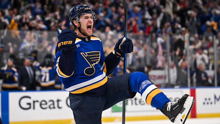 May 2, 2025; St. Louis, Missouri, USA; St. Louis Blues right wing Alexey Toropchenko (13) reacts after scoring a goal against the Winnipeg Jets during the second period in game six of the first round of the 2025 Stanley Cup Playoffs at Enterprise Center. Mandatory Credit: Connor Hamilton-Imagn Images