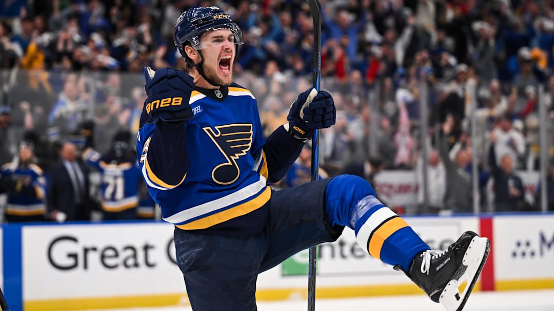 May 2, 2025; St. Louis, Missouri, USA; St. Louis Blues right wing Alexey Toropchenko (13) reacts after scoring a goal against the Winnipeg Jets during the second period in game six of the first round of the 2025 Stanley Cup Playoffs at Enterprise Center. Mandatory Credit: Connor Hamilton-Imagn Images