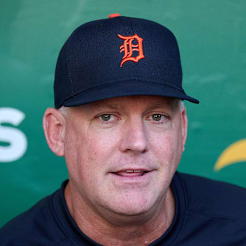 Sep 21, 2023; Oakland, California, USA; Detroit Tigers manager A.J. Hinch (14) talks to the media in the dugout before the game against the Oakland Athletics at Oakland-Alameda County Coliseum. Mandatory Credit: Robert Edwards-Imagn Images