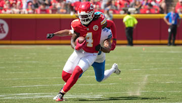 Aug 17, 2024; Kansas City, Missouri, USA; Kansas City Chiefs wide receiver Rashee Rice (4) runs the ball as Detroit Lions cornerback Khalil Dorsey (30) chases during the first half at GEHA Field at Arrowhead Stadium. Mandatory Credit: Denny Medley-Imagn Images