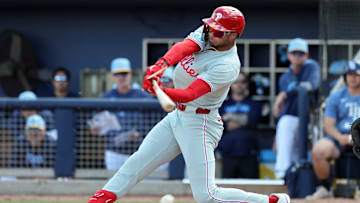 Feb 25, 2025; Port Charlotte, Florida, USA;  Philadelphia Phillies outfielder Justin Crawford (80) breaks his bat as he reaches on a fielders choice against the Tampa Bay Rays during the fourth inning at Charlotte Sports Park. 