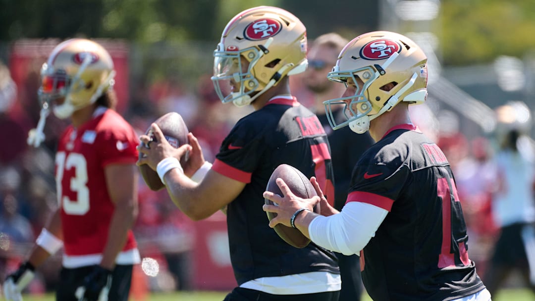 Jul 27, 2023; Santa Clara, CA, USA; San Francisco 49ers quarterback Brock Purdy (13) and quarterback Trey Lance (5) drop back to throw a pass during training camp at the SAP Performance Facility. Mandatory Credit: Robert Edwards-Imagn Images
