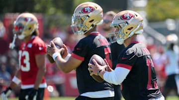 Jul 27, 2023; Santa Clara, CA, USA; San Francisco 49ers quarterback Brock Purdy (13) and quarterback Trey Lance (5) drop back to throw a pass during training camp at the SAP Performance Facility. Mandatory Credit: Robert Edwards-Imagn Images