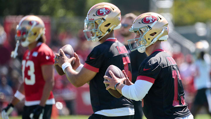 Jul 27, 2023; Santa Clara, CA, USA; San Francisco 49ers quarterback Brock Purdy (13) and quarterback Trey Lance (5) drop back to throw a pass during training camp at the SAP Performance Facility. Mandatory Credit: Robert Edwards-Imagn Images