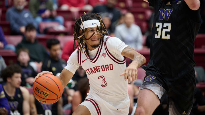 Jan 20, 2024; Stanford, California, USA; Stanford Cardinal guard Kanaan Carlyle (3) dribbles the ball against Washington Huskies forward Wilhelm Breidenbach (32) during the first half at Maples Pavilion. Mandatory Credit: Robert Edwards-USA TODAY Sports