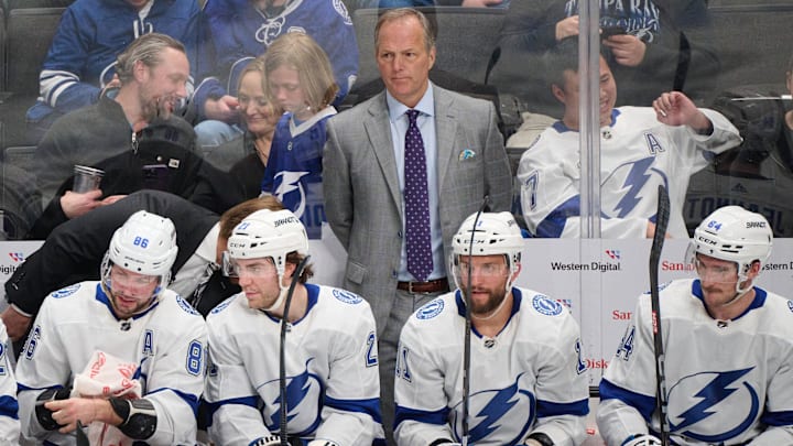 Mar 21, 2024; San Jose, California, USA; Tampa Bay Lightning head coach Jon Cooper watches game play against the San Jose Sharks during the third period at SAP Center at San Jose. Mandatory Credit: Robert Edwards-Imagn Images