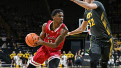 Xavier Amos drives to the basket during the Northern Illinois men's basketball game against Iowa at Carver-Hawkeye Arena.