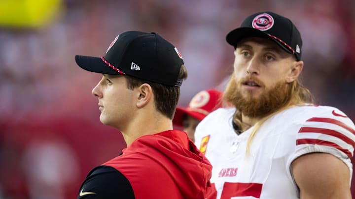 San Francisco 49ers quarterback Brock Purdy (left) with tight end George Kittle (85)