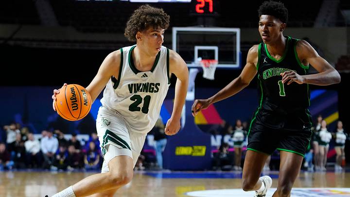 Sunnsylope forward Darius Wabbington (21) drives on St Mary’s forward Cam Williams (1) during the Open Boys Championship game at Arizona Veterans Memorial Coliseum in Phoenix on March 7, 2026.