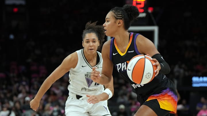 Aug 22, 2025; Phoenix, Arizona, USA; Phoenix Mercury forward Satou Sabally drives around Golden State Valkyries center Iliana Rupert (12) in the second half at Footprint Center. Mandatory Credit: Rick Scuteri-Imagn Images