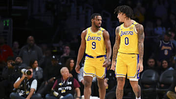 Nov 8, 2024; Los Angeles, California, USA; Los Angeles Lakers guard Jalen Hood-Schifino (0) and guard Bronny James (9) during the second half against the Philadelphia 76ers at Crypto.com Arena. Mandatory Credit: Jonathan Hui-Imagn Images