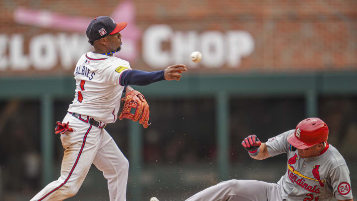  Atlanta Braves second baseman Ozzie Albies (1) turns a double play over St. Louis Cardinals right fielder Lars Nootbaar (21) during the ninth inning at Truist Park on July 21.