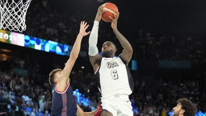 Aug 8, 2024; Paris, France; United States guard LeBron James (6) goes to the basket during the second half against Serbia in a men's basketball semifinal game during the Paris 2024 Olympic Summer Games at Accor Arena. Mandatory Credit: Kyle Terada-USA TODAY Sports