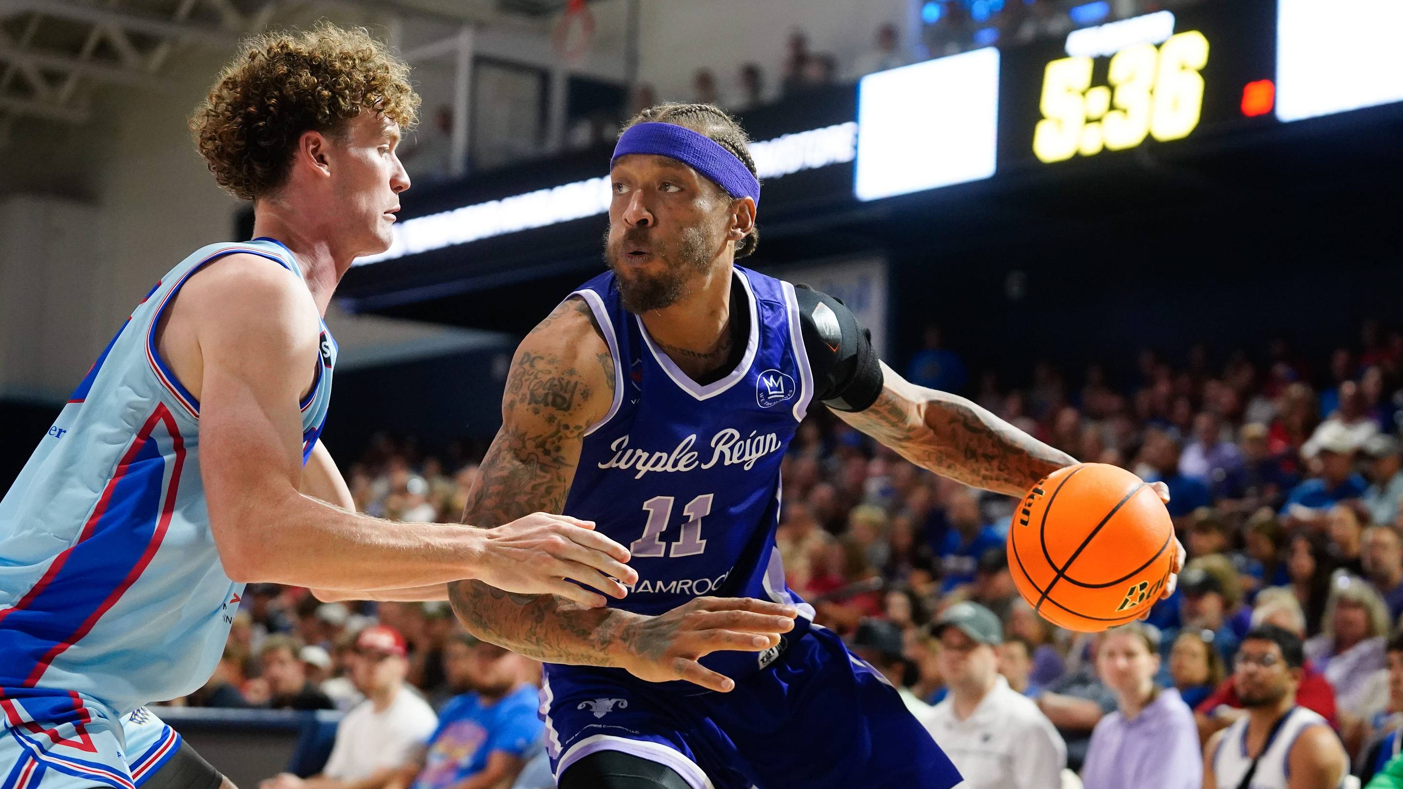 Purple Reign forward Michael Beasley (11) drives the ball against JHX Hoops forward Andrew Orr (25) during the first round of The Basketball Tournament inside Lee Arena on July 22, 2026. | USA TODAY Network via Reuters Connect