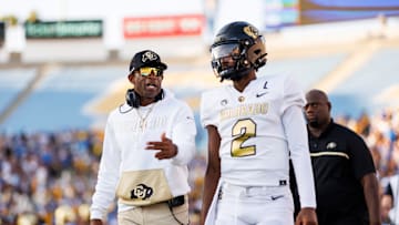 Shedeur Sanders with Deion Sanders.