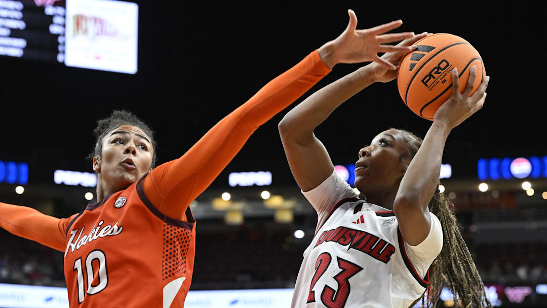 Jan 4, 2026; Louisville, Ky.; Louisville guard Skylar Jones (23) shoots against Virginia Tech forward Carys Baker (10).