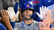 Aug 13, 2025; Toronto, Ontario, CAN;  Chicago Cubs third baseman Matt Shaw (8) celebrates with teammates in the dugout after hitting a solo home run against the Toronto Blue Jays in the fifth inning at Rogers Centre.