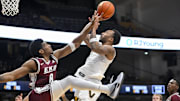 Nov 12, 2025; Nashville, Tennessee, USA;  Vanderbilt Commodores guard Frankie Collins (1) shoots over  Eastern Kentucky Colonels forward Jalen Cooper (8) during the second half at Memorial Gymnasium. Mandatory Credit: Steve Roberts-Imagn Images