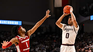 Texas A&M Aggies guard Dexter Dennis (0) shoots a three pointer over Arkansas Razorbacks guard Ricky Council IV (1) during the second half at Reed Arena.