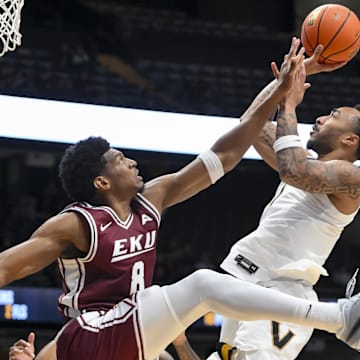 Nov 12, 2025; Nashville, Tennessee, USA;  Vanderbilt Commodores guard Frankie Collins (1) shoots over  Eastern Kentucky Colonels forward Jalen Cooper (8) during the second half at Memorial Gymnasium. Mandatory Credit: Steve Roberts-Imagn Images