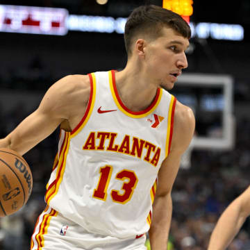 Apr 4, 2024; Dallas, Texas, USA; Atlanta Hawks guard Bogdan Bogdanovic (13) brings the ball up court against the Dallas Mavericks during the first half at the American Airlines Center.