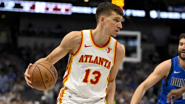 Apr 4, 2024; Dallas, Texas, USA; Atlanta Hawks guard Bogdan Bogdanovic (13) brings the ball up court against the Dallas Mavericks during the first half at the American Airlines Center.