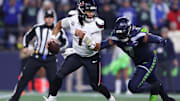 Oct 20, 2025; Seattle, Washington, USA; Houston Texans quarterback C.J. Stroud (7) is chased by Seattle Seahawks linebacker Uchenna Nwosu (7) during the first quarter at Lumen Field. Mandatory Credit: Kevin Ng-Imagn Images