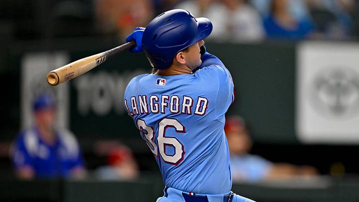 Jun 21, 2026; Arlington, Texas, USA; Texas Rangers center fielder Wyatt Langford (36) hits a three run home run against the San Diego Padres during the third inning at Globe Life Field. Mandatory Credit: Jerome Miron-Imagn Images