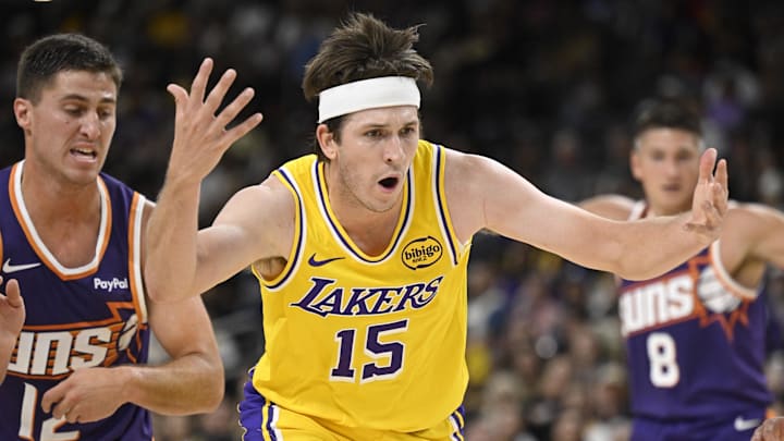 Oct 3, 2025; Palm Desert, California, USA; Los Angeles Lakers guard Austin Reaves (15)  loses the ball during the first half against the Phoenix Suns at Acrisure Arena. Mandatory Credit: Denis Poroy-Imagn Images