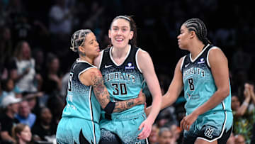 Jun 19, 2025; Brooklyn, New York, USA; New York Liberty forward Breanna Stewart (30) is greeted by guard Natasha Cloud (9) and center Nyara Sabally (8) after scoring s basket against the Phoenix Mercury during the second half at Barclays Center. Mandatory Credit: John Jones-Imagn Images