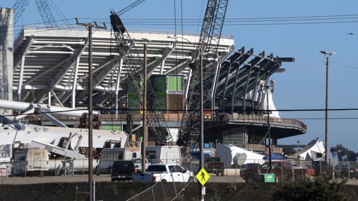 Sep 18, 2018; Inglewood, CA, USA; An airplane flies over the construction site of LA Stadium &