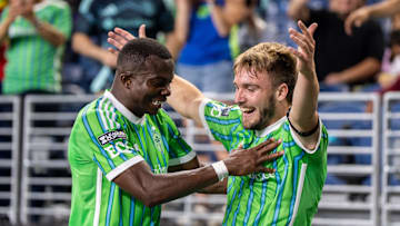 Jul 31, 2025; Seattle, Washington, USA;  Seattle Sounders forward Pedro de la Vega (10), right, celebrates with defender Nouhou Tolo (5) after scoring a goal during the second half against Cruz Azul at Lumen Field. Mandatory Credit: Stephen Brashear-Imagn Images