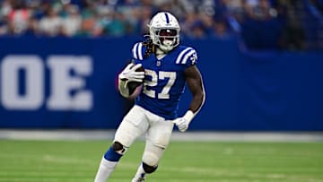 Oct 20, 2024; Indianapolis, Indiana, USA; Indianapolis Colts running back Trey Sermon (27) runs the ball during the second half against the Miami Dolphins at Lucas Oil Stadium. Mandatory Credit: Marc Lebryk-Imagn Images