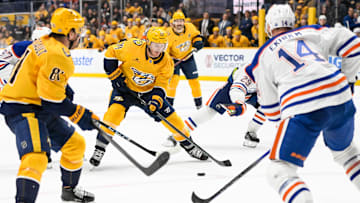Oct 17, 2024; Nashville, Tennessee, USA;  Nashville Predators center Gustav Nyquist (14) skates against the Edmonton Oilers during the third period at Bridgestone Arena. Mandatory Credit: Steve Roberts-Imagn Images