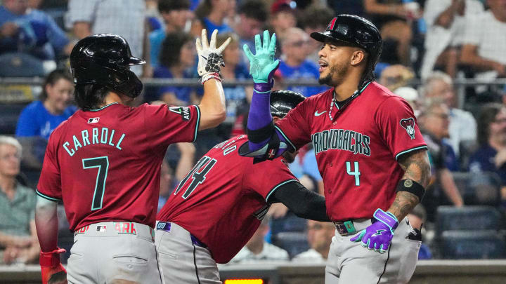 Jul 24, 2024; Kansas City, Missouri, USA; Arizona Diamondbacks second baseman Ketel Marte (4) celebrates with right fielder Corbin Carroll (7) after hitting a three-run home run against the Kansas City Royals in the ninth inning at Kauffman Stadium. Mandatory Credit: Denny Medley-USA TODAY Sports