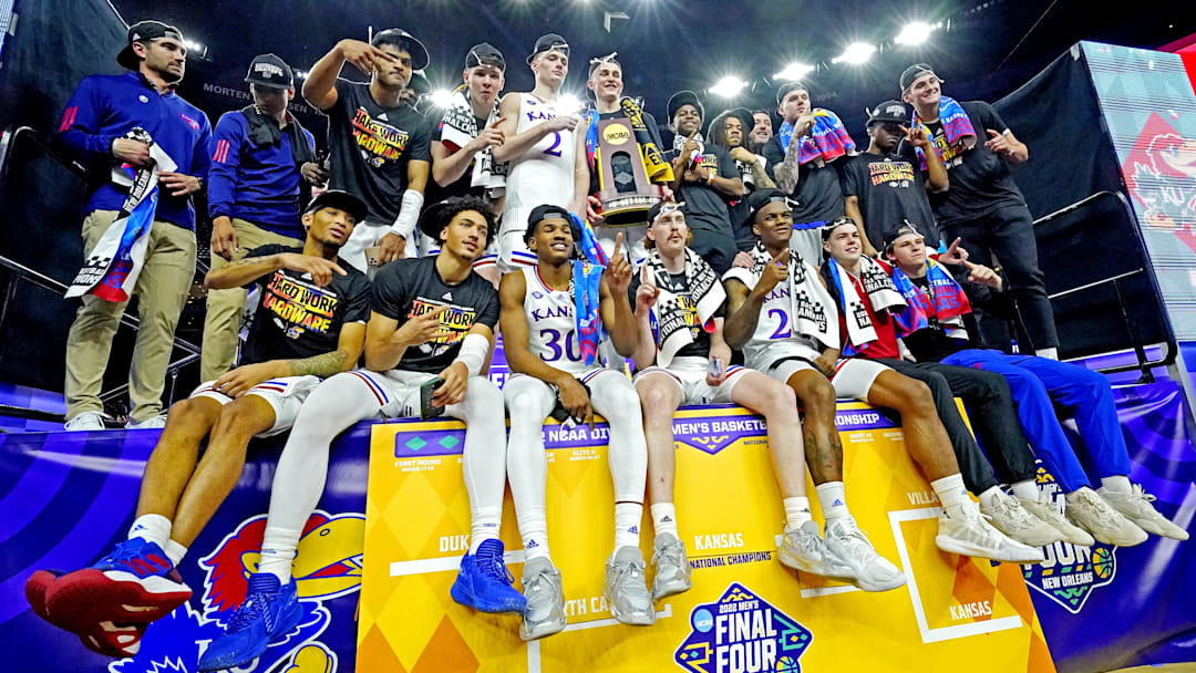 Apr 4, 2022; New Orleans, LA, USA; The Kansas Jayhawks celebrates after beating the North Carolina Tar Heels during the 2022 NCAA men's basketball tournament Final Four championship game at Caesars Superdome. Mandatory Credit: Robert Deutsch-Imagn Images