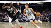 Jan 10, 2025; Orlando, Florida, USA; Orlando Magic forward Tristan da Silva (23) does the ball past Milwaukee Bucks forward Taurean Prince (12) in the fourth quarter at Kia Center. Mandatory Credit: Nathan Ray Seebeck-Imagn Images