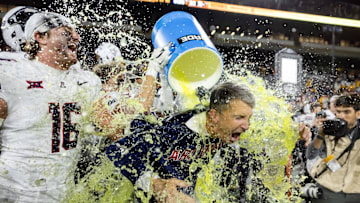 Nov 28, 2025; Tempe, Arizona, USA; Arizona Wildcats head coach Brent Brennan is doused with Powerade after defeating the Arizona State Sun Devils during the 99th Territorial Cup at Mountain America Stadium. Mandatory Credit: Mark J. Rebilas-Imagn Images