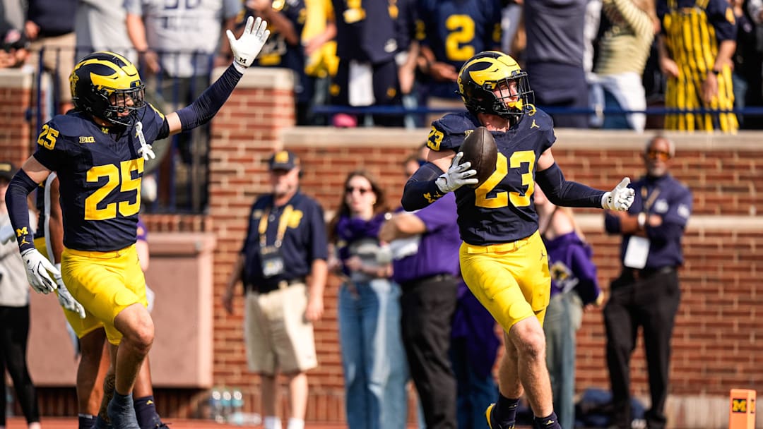 Michigan linebacker Cole Sullivan (23) celebrates an interception against Washington during the second half at Michigan Stadium in Ann Arbor on Saturday, Oct. 18, 2025.