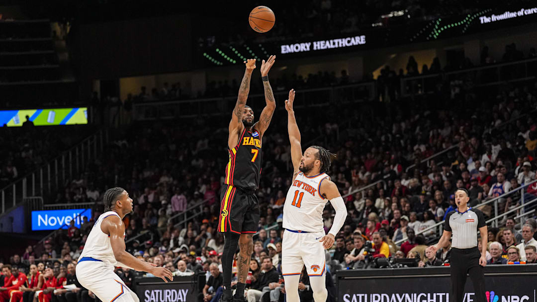 Apr 6, 2026; Atlanta, Georgia, USA; Atlanta Hawks guard Nickeil Alexander-Walker (7) shoots over New York Knicks guard Jalen Brunson (11) during the second half at State Farm Arena. Mandatory Credit: Dale Zanine-Imagn Images