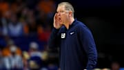 Mar 20, 2025; Lexington, KY, USA;  Utah State Aggies head coach Jerrod Calhoun calls to his team during the first half against the UCLA Bruins in the first round of the NCAA Tournament at Rupp Arena. Mandatory Credit: Aaron Doster-Imagn Images